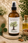 Huile d'amande douce biologique Blanchou présentée dans une bouteille ambrée de 118 ml avec pompe de soin, dans un décor naturel évoquant les soins de la peau et des cheveux.